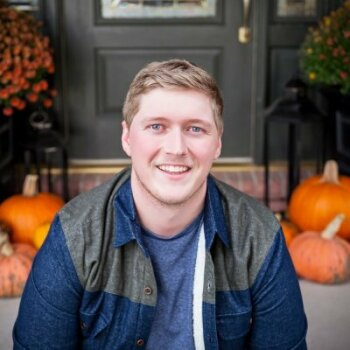 Isaac Slavens with pumpkins in background