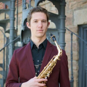 Mark Ivlev holding instrument