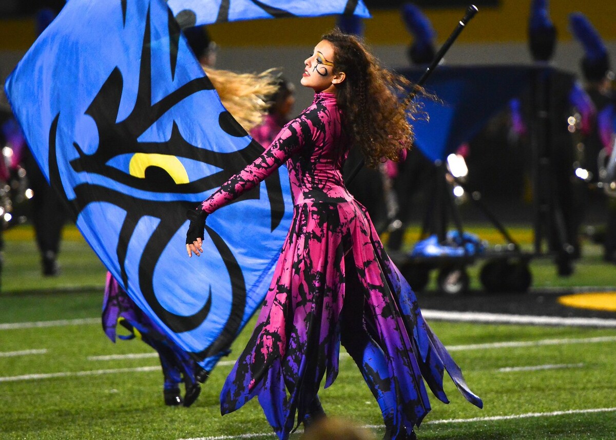 Color guard adds 'visual attribute' to marching band – The Red Ledger