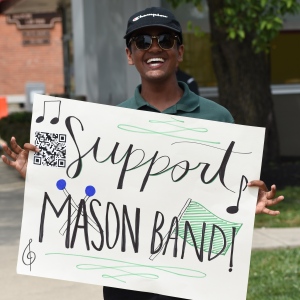 person holding Support Mason Band sign